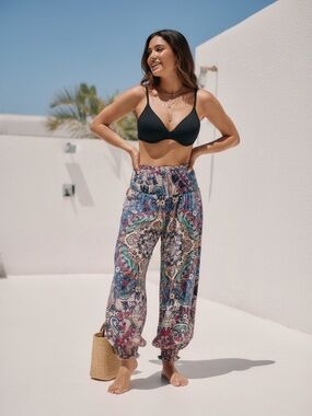 Anthropologie bohemian printed gauze pants featuring a smocked waist